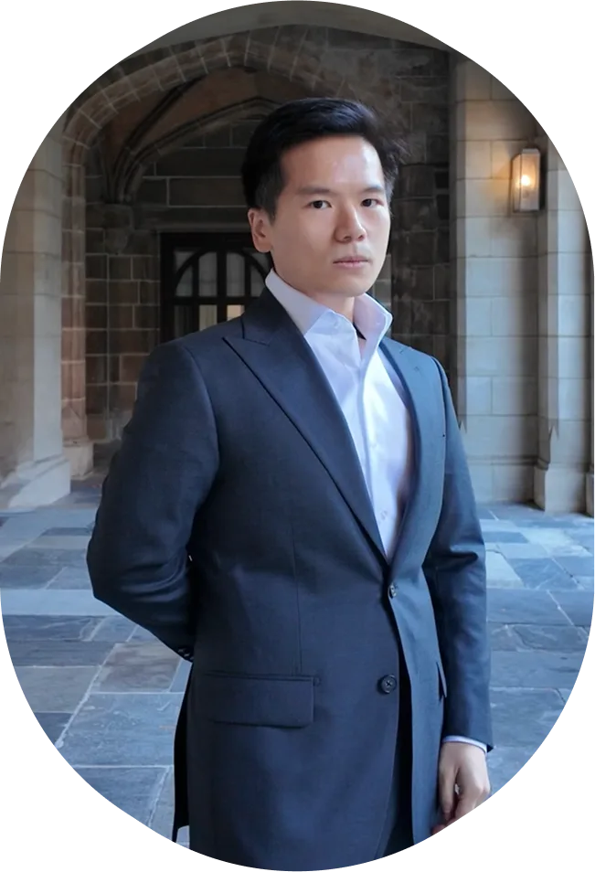Peiyu (Vincent) Wang wearing a charcoal suit with peak lapels